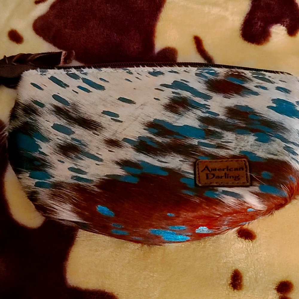 An American Darling purse with matching cosmetic bag